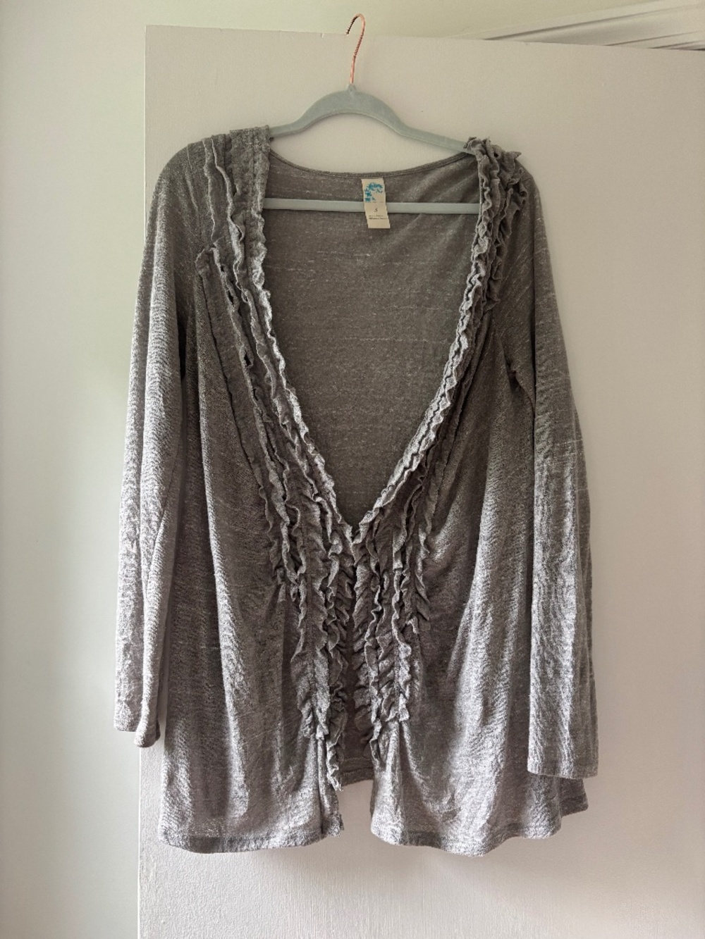 Cardigan with ruffles and hook and eye